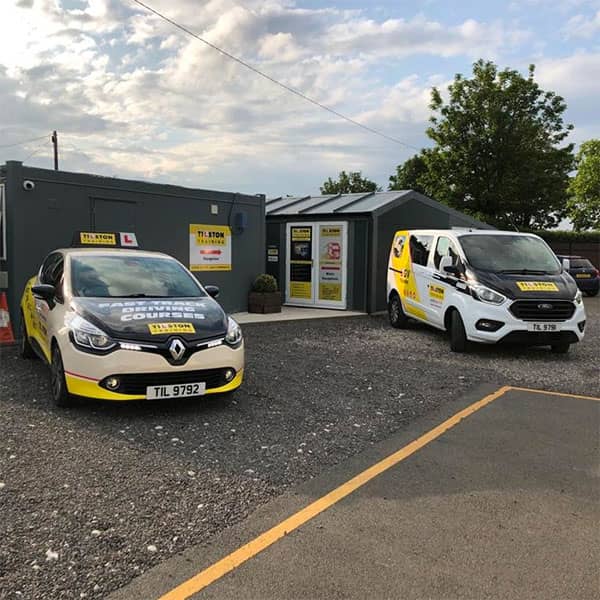 Vehicles parked outside Tilston Training