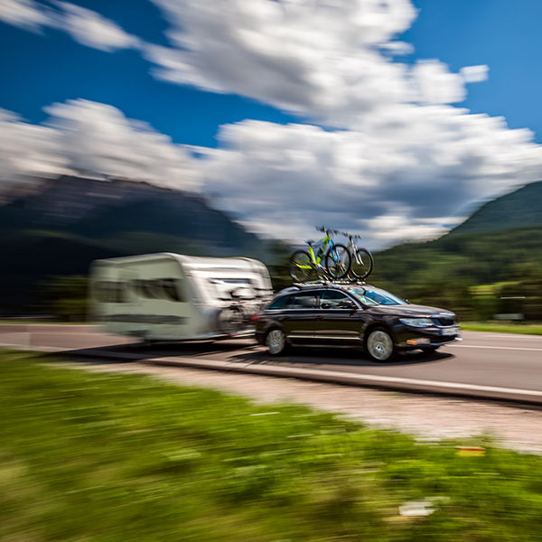 Caravan being towed by car in North Wales