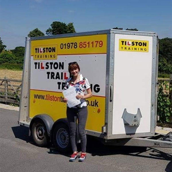 Woman passing her trailer towing test